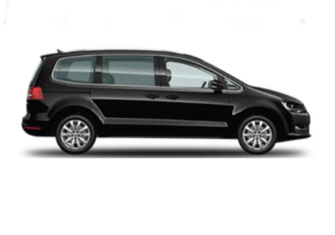 A black Volkswagen Touran is displayed, showcasing its sleek design and modern features.