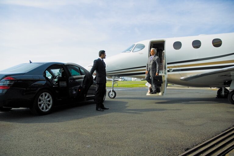 A man in a suit disembarks from a private jet, exuding professionalism and sophistication.