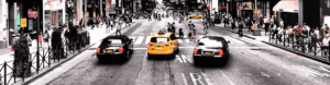 A bustling city street filled with cars and pedestrians navigating through the vibrant urban environment.