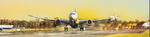 A large jet airplane ascends into the sky as it takes off from the runway, showcasing its powerful engines and wings.