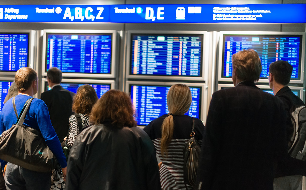 People waiting for flight at the airport. Back view.