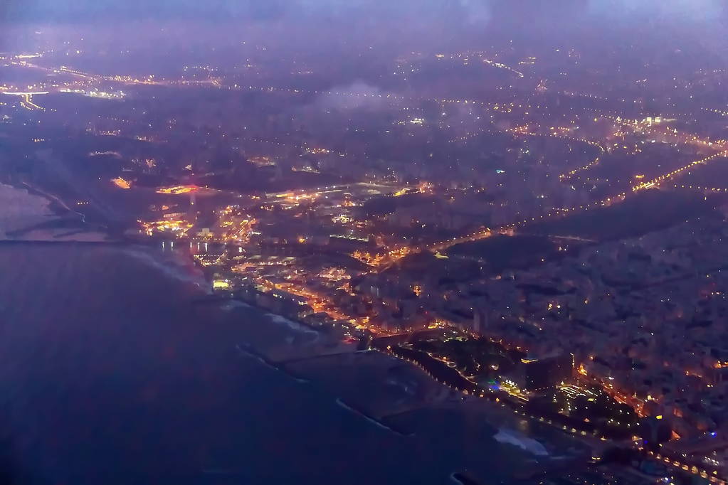 Night flight over Tel Aviv and Mediterranean Sea