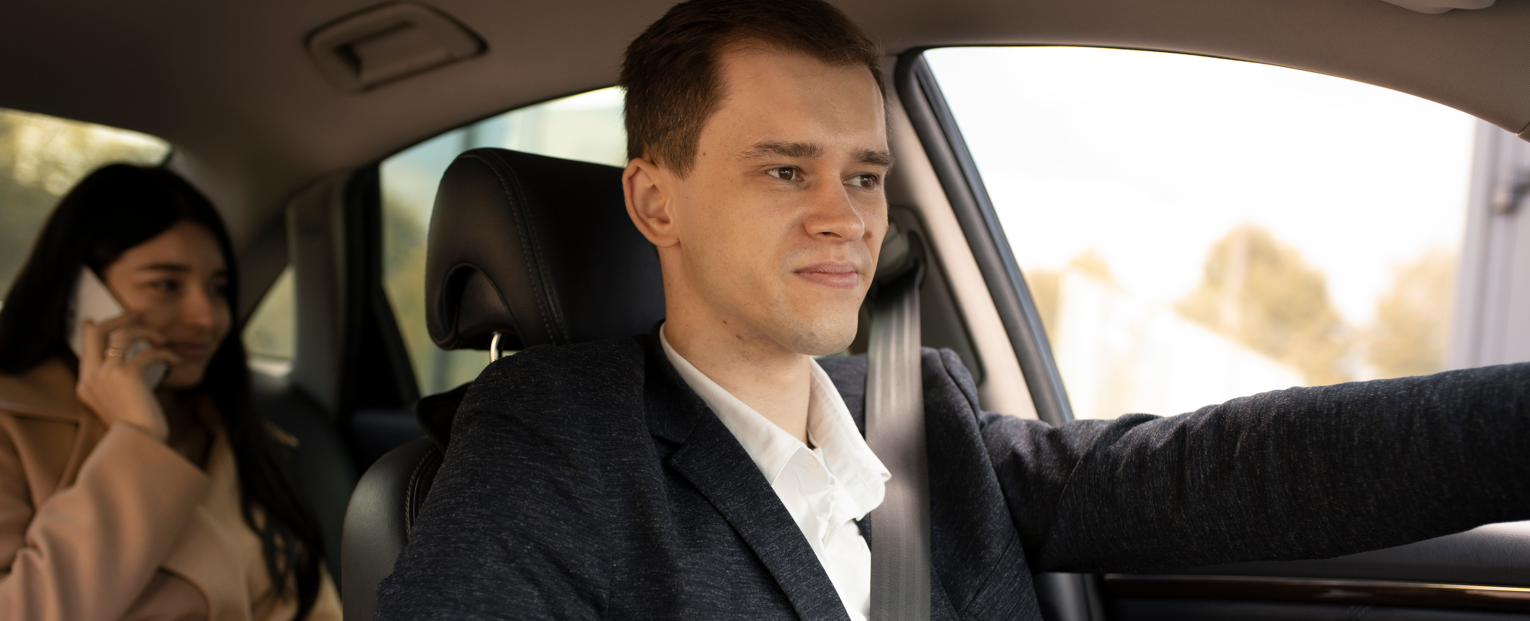 Taxi driver and client in a car