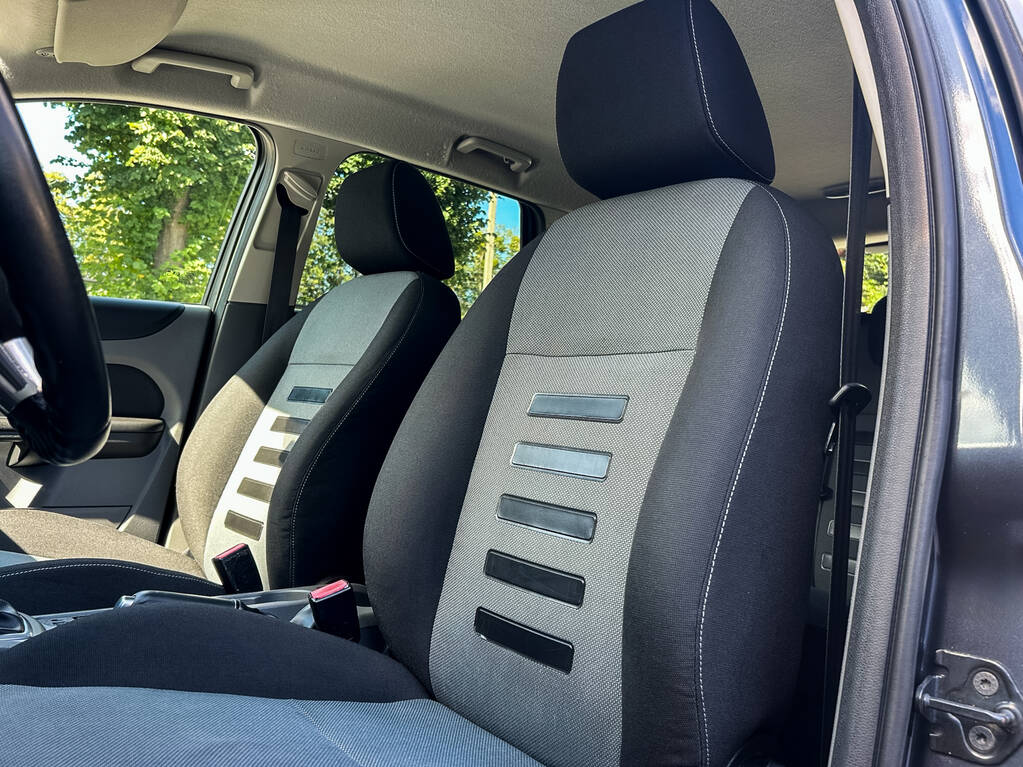 Explore the elegant design of a car interior with modern upholstery, striking patterns, and unmatched comfort, all adhering to the highest automotive standards