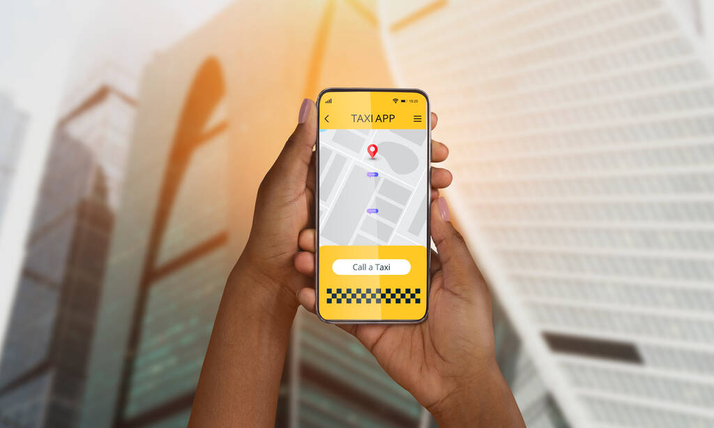 Closeup of black woman holding smartphone with taxi services mobile app on screen, using map to find cab ride destination at city street. Online transportation booking application