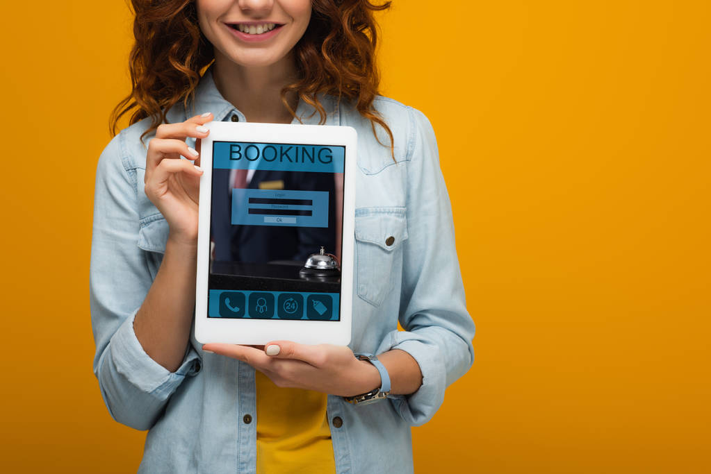 Cropped view of a girl holding digital tablet