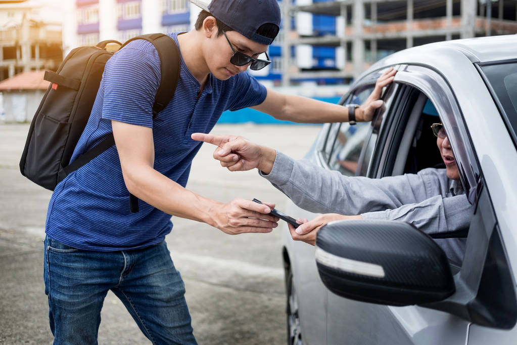 tourists or traveler seek advice map with smart phone from taxi drivers