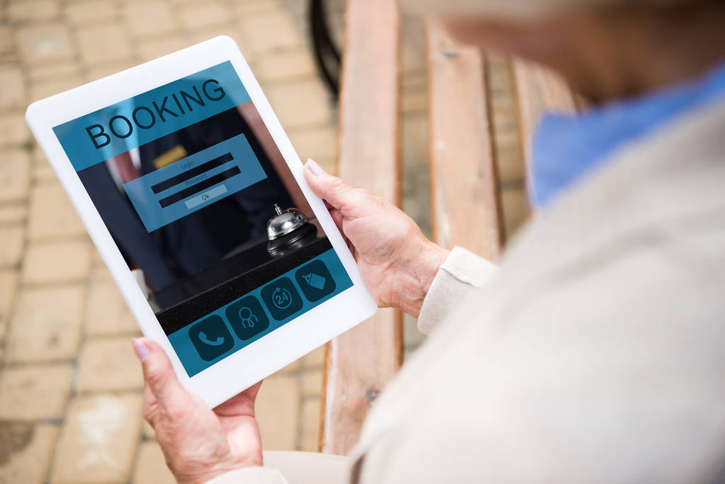 View of woman using digital laptop screen