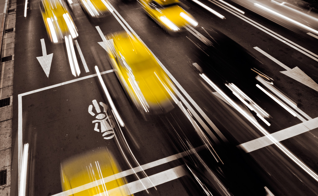 Taxi in modern city with motion blurred.