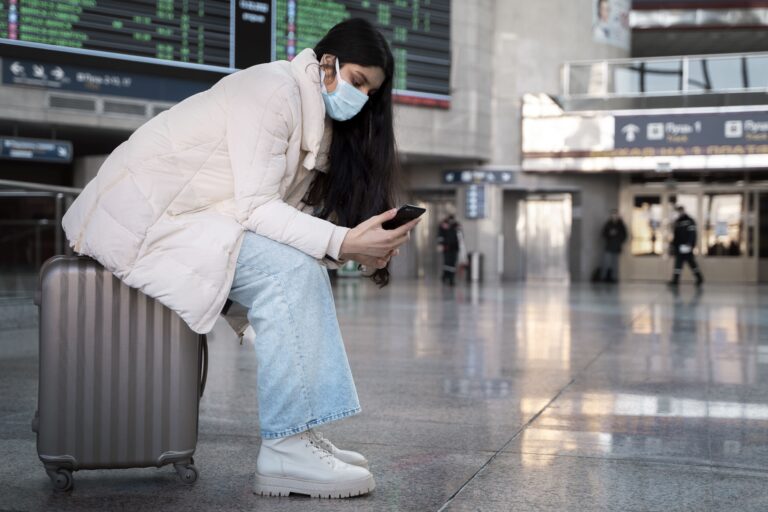 young-adult-traveling-with-vaccination-passport