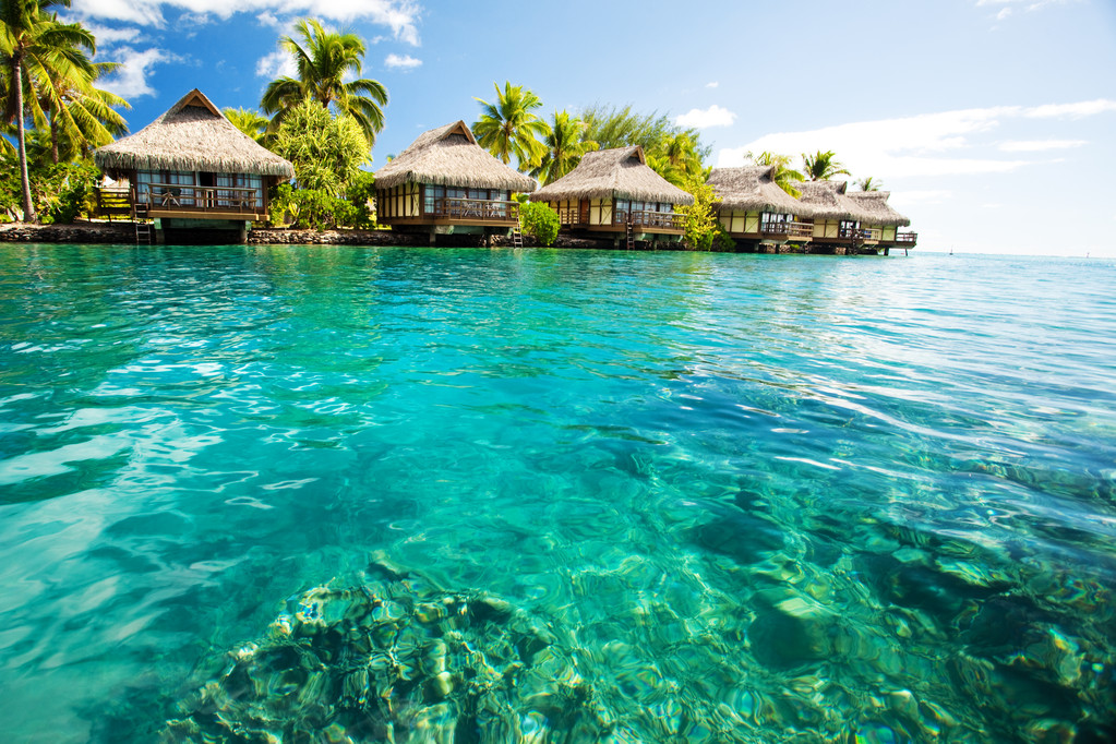 Over water bungalows with steps into amazing green lagoon