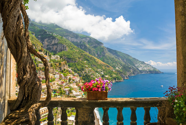 View of positano from antique terrace with flowers