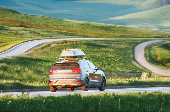 Car in countryside with roofbox