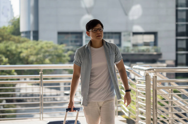 Young tourist pulling luggage travel